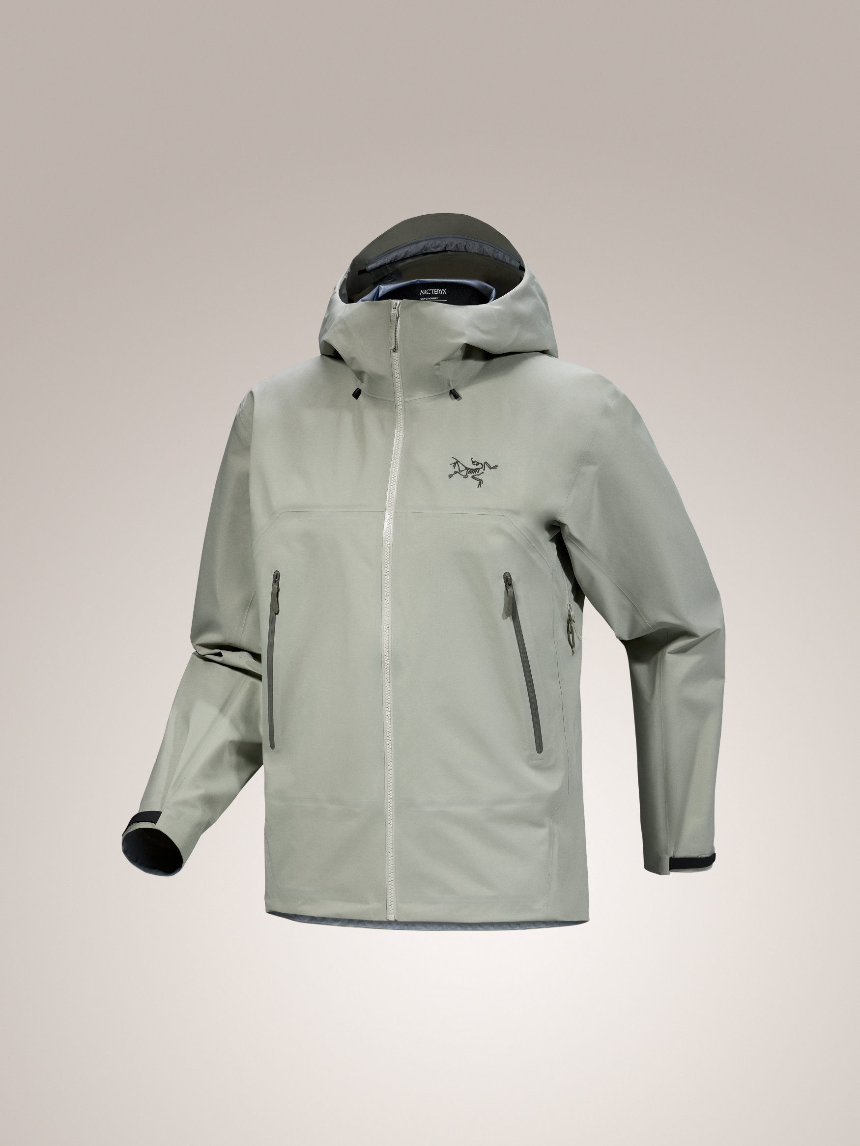 Arc'teryx Beta SL Men's Jacket in light green GORE-TEX, featuring a hood, front zipper, and dark zippered pockets.