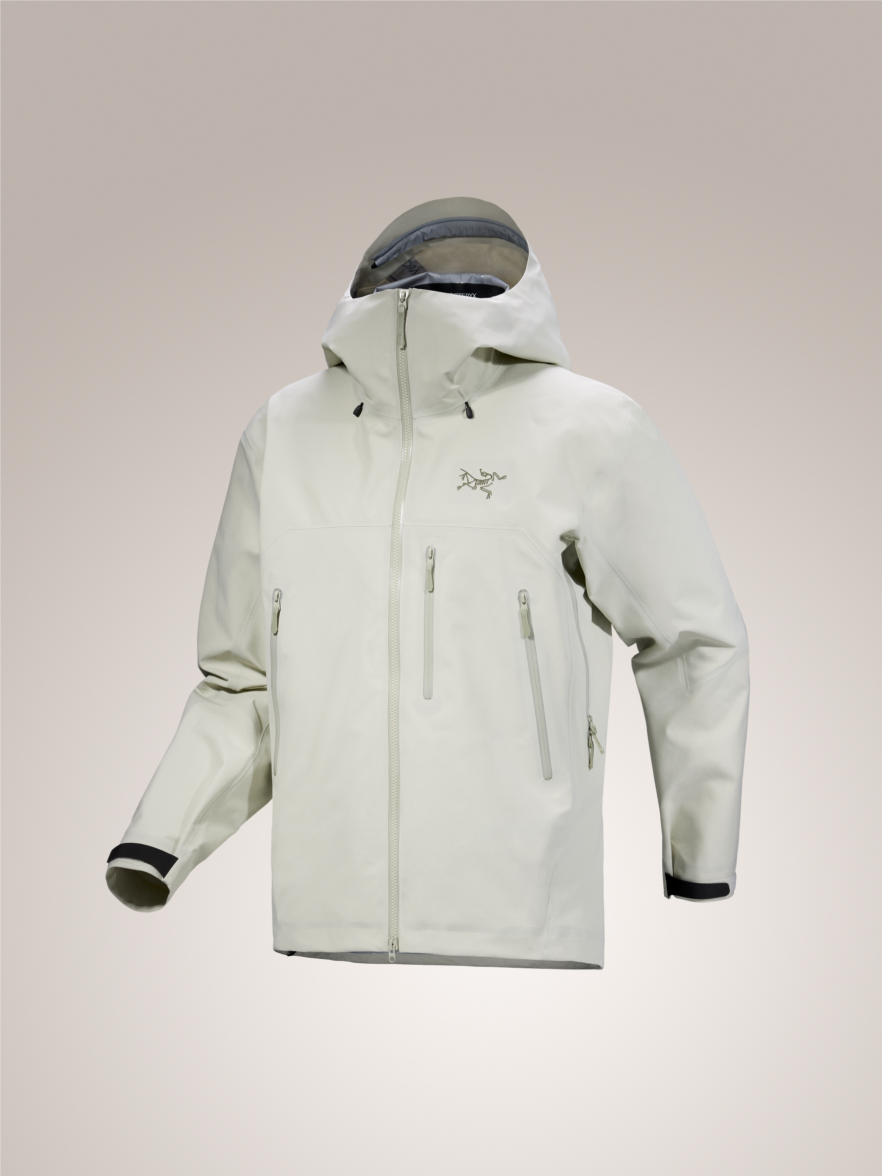 Men's Arc'teryx Beta SV GORE-TEX PRO ePE shell jacket in light beige with hood and multiple zippered pockets.