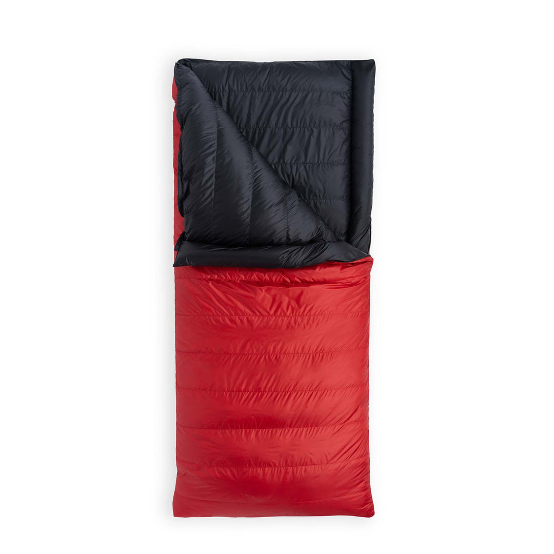 Cardinal red Feathered Friends Condor sleeping bag partially unzipped on white background