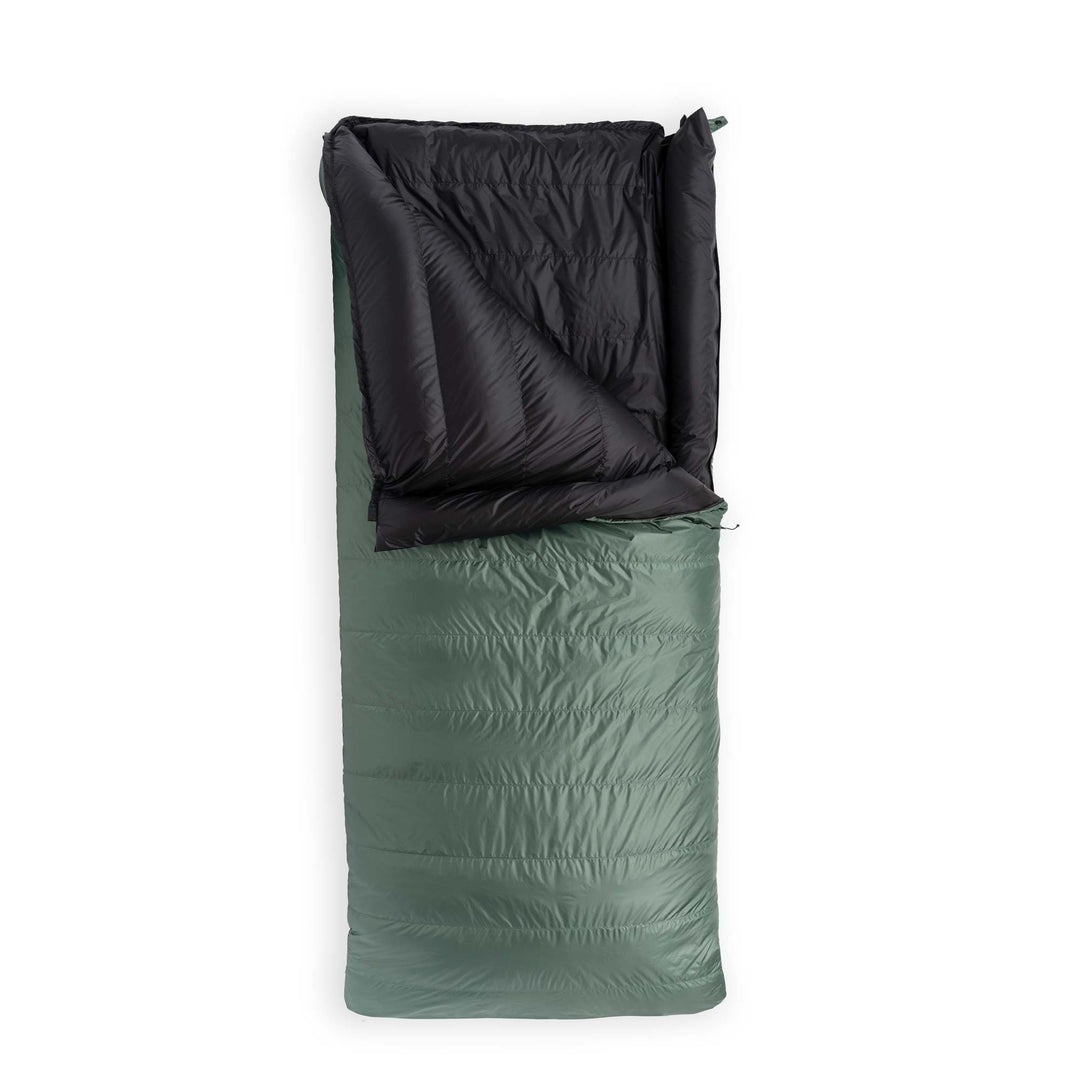 Fir green Feathered Friends Condor sleeping bag partially unzipped on white background